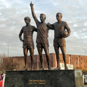 United Trinity outside Old Trafford